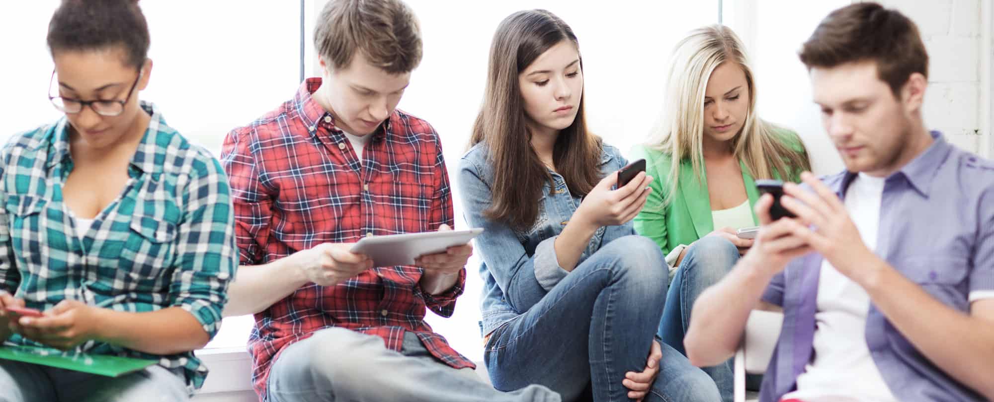 Teenagers Using Phone to- Contact us